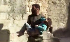 A girl is carried from the rubble after airstrikes in Aleppo.