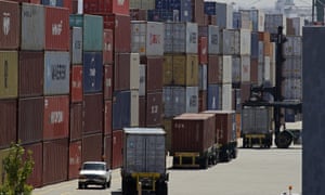 Stacked containers wait to be loaded on to trucks at the Port of Oakland in California.