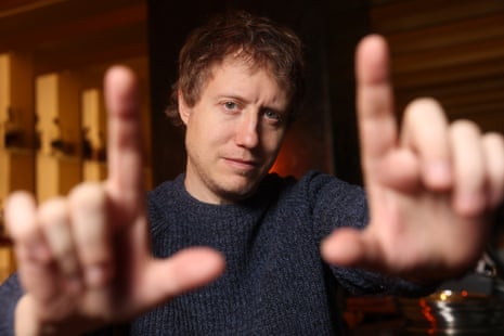 Director László Nemes extends both hands toward the camera