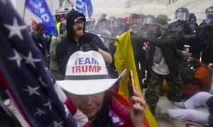 Trump supporters try to break through a police barrier at the Capitol in Washington