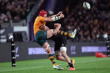 Harry Wilson feels the full force of a crunching tackle by New ZealandâÂÂs Anton Segner
