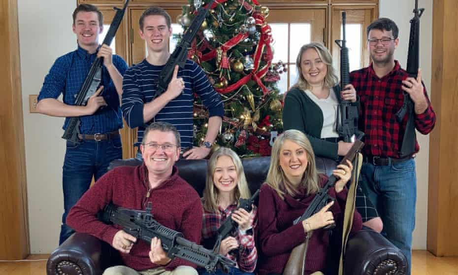 Thomas Massie, from Kentucky, posted a Christmas picture of himself and six others holding firearms resembling machine guns and semi-automatic weapons.
