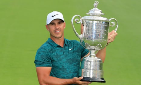 Brooks Koepka holds the Wanamaker Trophy after winning the US PGA Championship at Bellerive.