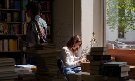 Customer reads a book in Sens cafe in Pechersk, Kyiv.