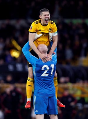 Wolves’ Conor Coady and John Ruddy celebrate after the match as their club progresses to a 15th FA Cup semi-final but a first since 1997-98.