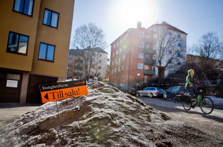 A for sale sign in the street outside residential buildings in the Midsommarkransen neighbourhood of Stockholm, Sweden, in 2013.