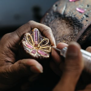 Adding gems to an earing design.