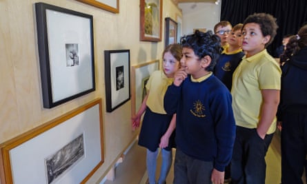 Children look at art works