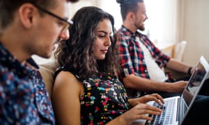 A group of young friends with laptop indoors