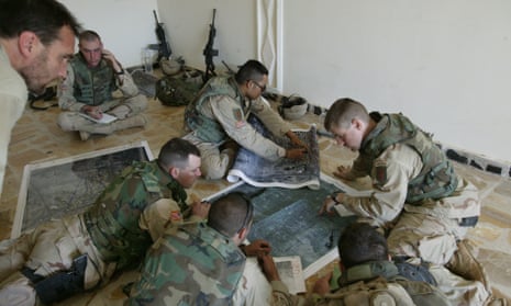 Michael Ware, left, with US troops in Iraq, in an image taken from Only the Dead.