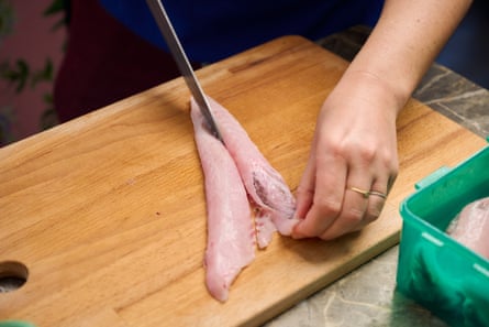 Chef slicing fresh flathead tails