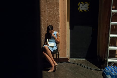 Alexandria Ocasio-Cortez reviews her notes backstage.