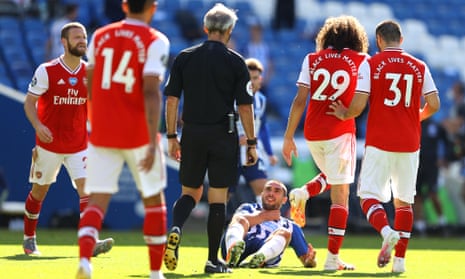 Neal Maupay of Brighton and Hove Albion reacts after being confronted by Matteo Guendouzi of Arsenal.