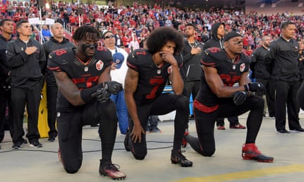 San Francisco 49ers players Eli Harold, Colin Kaepernick and Eric Reid kneel in protest during the playing of the national anthem before a game on 6 October 2016.