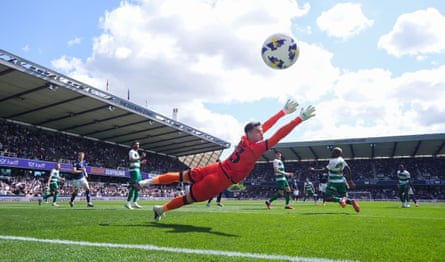 Derek Mazou-Sacko scores Millwall’s first goal past QPR’s Joe Walsh