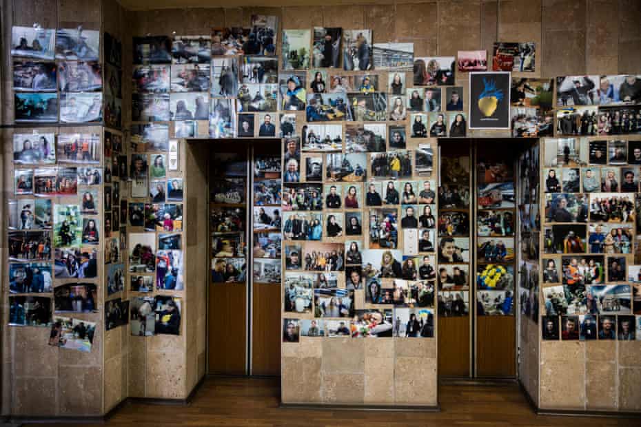 Photographs on the wall of the volunteer coordination centre in Dnipro.