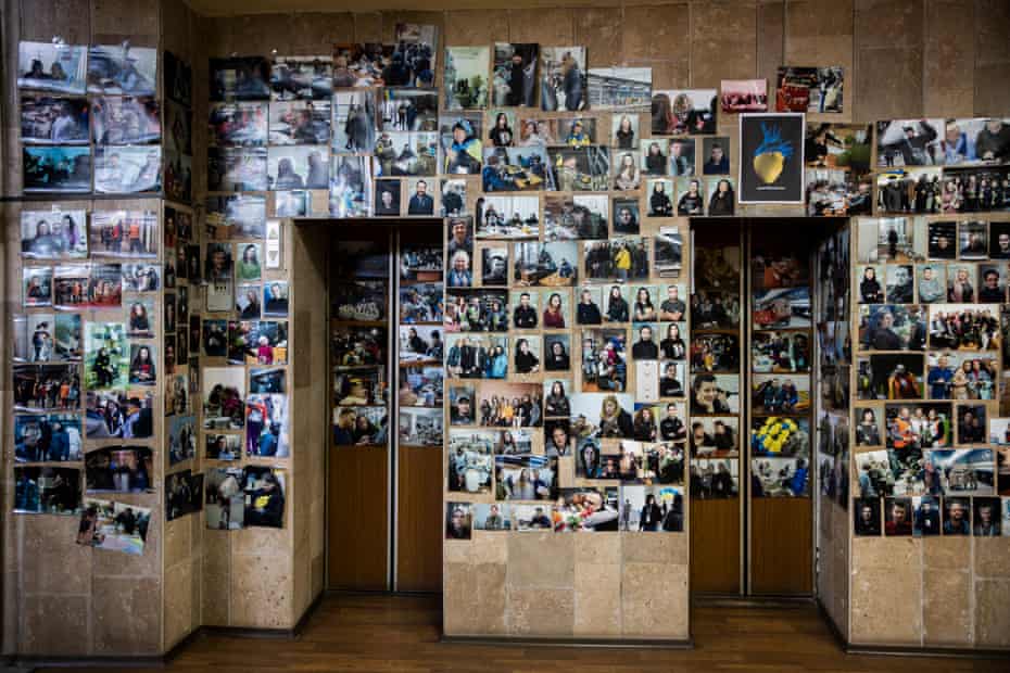 Photographs on the wall of the volunteer coordination center in Dnipro.