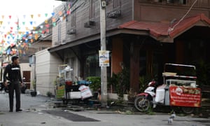 A Thai police officer at the site where a small bomb exploded in Hua Hin on Thursday night.