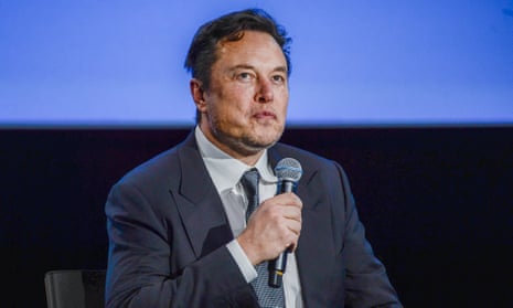 Elon Musk holds mic