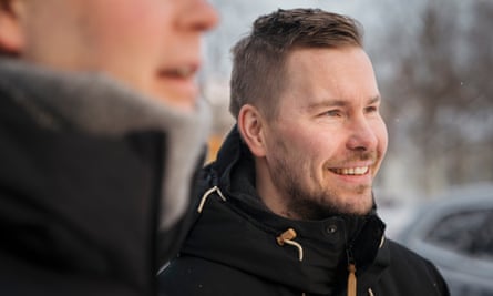 Jussi Hiltunen smiles while wearing a dark jacket