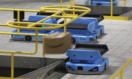 An Amazon robot sends a package down a chute at a warehouse facility in Goodyear, Arizona, on 17 December 2019.