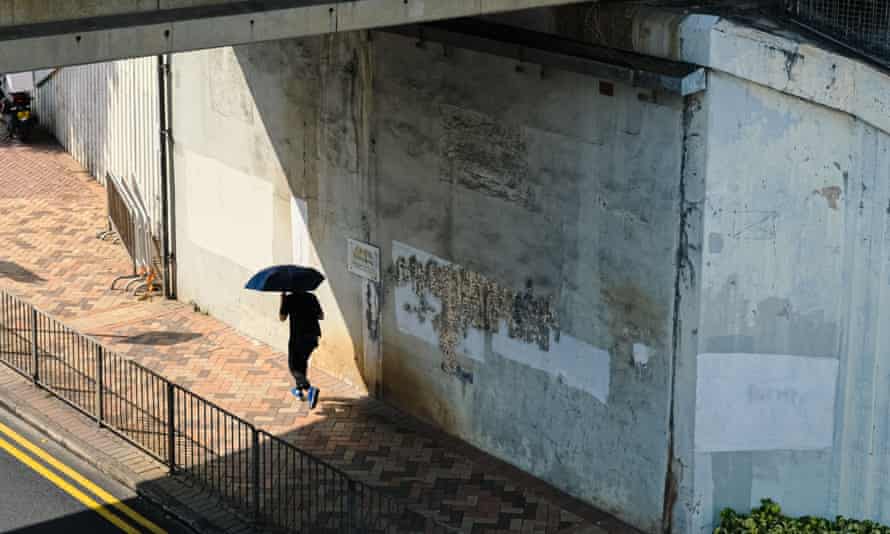 A partially revealed work of Tsang’s under a bridge in Hong Kong.