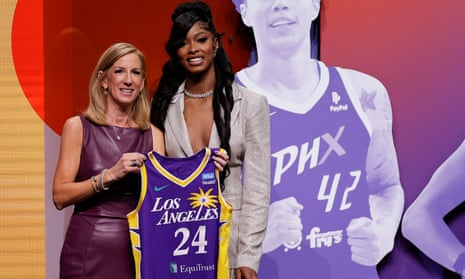 Rick Jackson poses with the WNBA commissioner Cathy Engelbert after being selected fourth overall by the Los Angeles Sparks