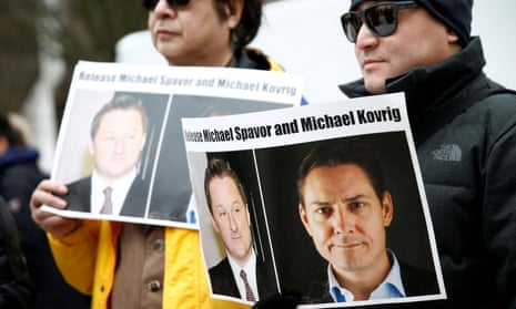 People hold signs calling for China to release the Canadian detainees Michael Spavor and Michael Kovrig in Vancouver