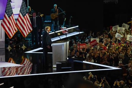 a man speaks to a crowd of his supporters