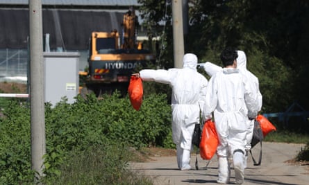Quarantine officials inspect a pig farm in Yeoncheon, South Korea.
