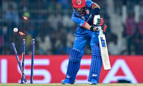 Afghanistan's Rahmanullah Gurbaz is clean bowled by New Zealand's Matt Henry.