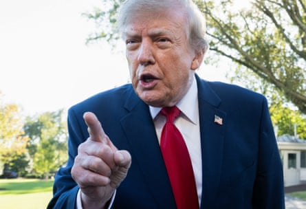 Donald Trump pointing at the camera with an angry look