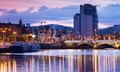 Belfast city skyline along River Lagan at dusk