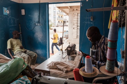 Bada Seck at work in his tailor shop in Ngor, Dakar.