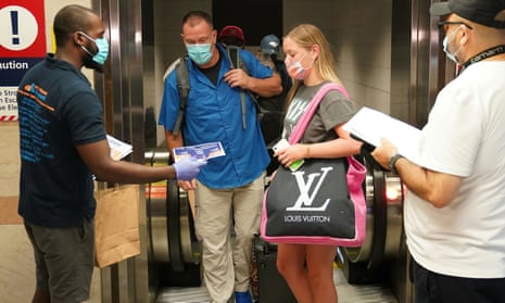 Passengers on a train from Florida stop and register with officials at Penn Station in New York during an effort to screen out-of-state travellers and enforce the state’s 14-day coronavirus quarantine.