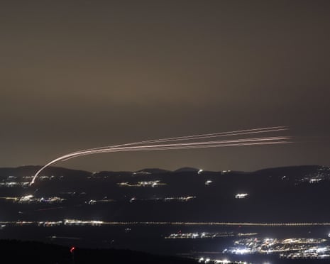 Israeli air defence systems intercept projectiles over the Upper Galilee region in northern Israel