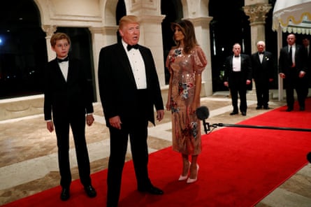 Donald Trump and first lady Melania Trump, with their son Barron, arrive for a New Year’s Eve party at his Mar-a-Lago club in 2017.