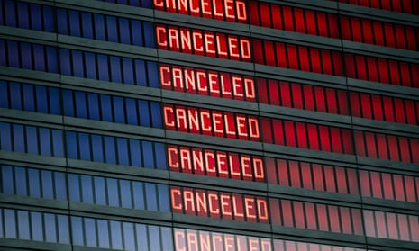 A flight information board displaying cancelled flights.