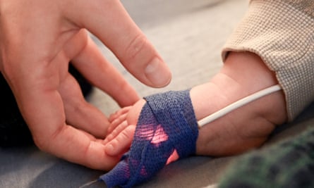 An oximeter is arranged on a baby’s hand in Germany, where human respiratory syncytial virus (RSV) is pushing some hospitals to their limits.