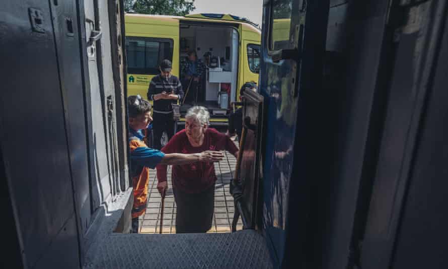 A woman boards an evacuation train in Pokrovsk, Donetsk Oblast, Ukraine, on May 30, 2022.