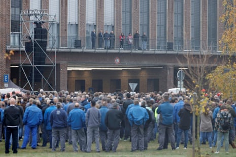 large group of people stand outside