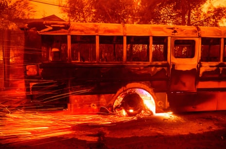 Embers fly off a burning bus at Aveson School of Leaders elementary school.