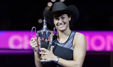 Caroline Garcia receives the Billie Jean King trophy – and a cowboy hat – after victory in Texas.