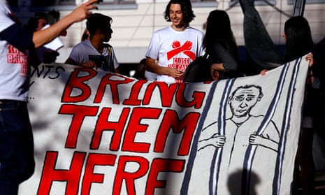 Protesters with a 'bring them here' sign
