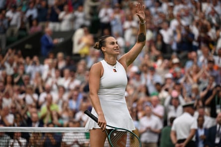 Sryna Sabalenka waves to the crowd after her victory against Elise Mertens