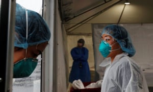 Health workers in the Bronx, New York, on 21 April.