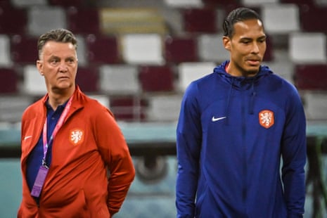 Louis Van Gaal (left) and Netherlands defender Virgil van Dijk survey the surroundings of the Khalifa Stadium yesterday.