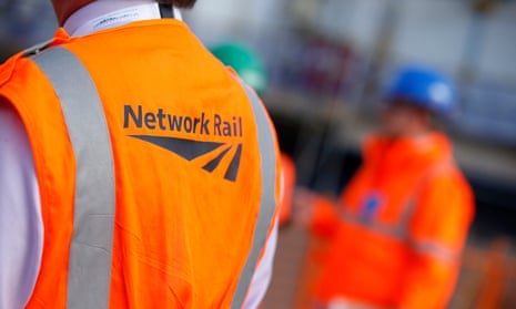 A worker wearing a Network Rail jacket