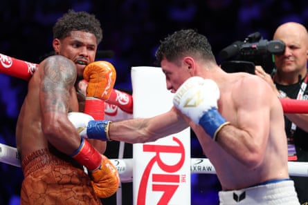 William Zepeda, right, lands a punch on Shakur Stevenson, left, during their lightweight title fight at Louis Armstrong Stadium on Saturday night.