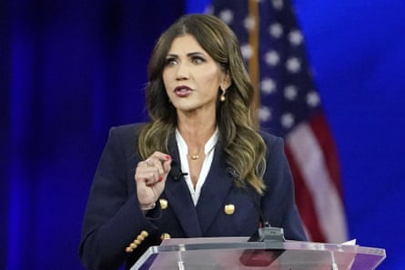 Kristi Noem at a lectern.